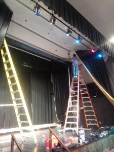 An 18-foot ceiling makes tall ladders a necessity. We prepped the mounting points prior to the install crew's arrival